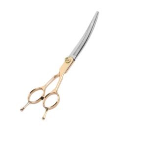 Professional curved pet grooming scissors showing a two-tone design with stainless steel silver blades and a metallic gold handle featuring dual finger rests, isolated on a white background, as seen in 143.jpg.