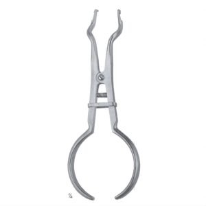 A medical-grade surgical stainless steel Ivory style rubber dam punch featuring an extended plier-style frame, a rotating wheel with multiple sizing holes, a sharp conical punching pin, and an ergonomic handle with a textured cross-hatched grip isolated on a white background.