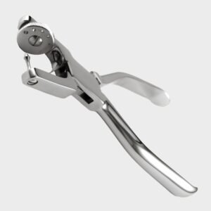 An angled, close-up perspective view of a high-polished surgical stainless steel Ainsworth style rubber dam punch, highlighting its rotating multi-hole wheel anvil, sharp conical punching pin, and sleek curved plier handles isolated on a light gray background.