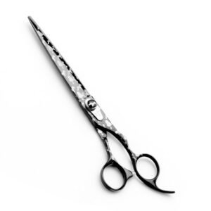 Professional stainless steel pet grooming shears completely coated in a glossy black finish with a decorative silver-grey pattern of poodle silhouettes, featuring an adjustable tension knob with a dog emblem, a built-in finger rest, and a translucent rubber silencer bumper, shown in 18.jpg against a clean white background.